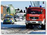 Polizeiwagen und TLF Feuerwehr Bad Essen in Wehrendorf